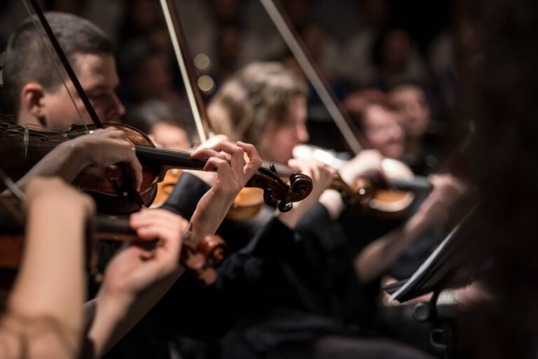 violinists playing in an orchestra